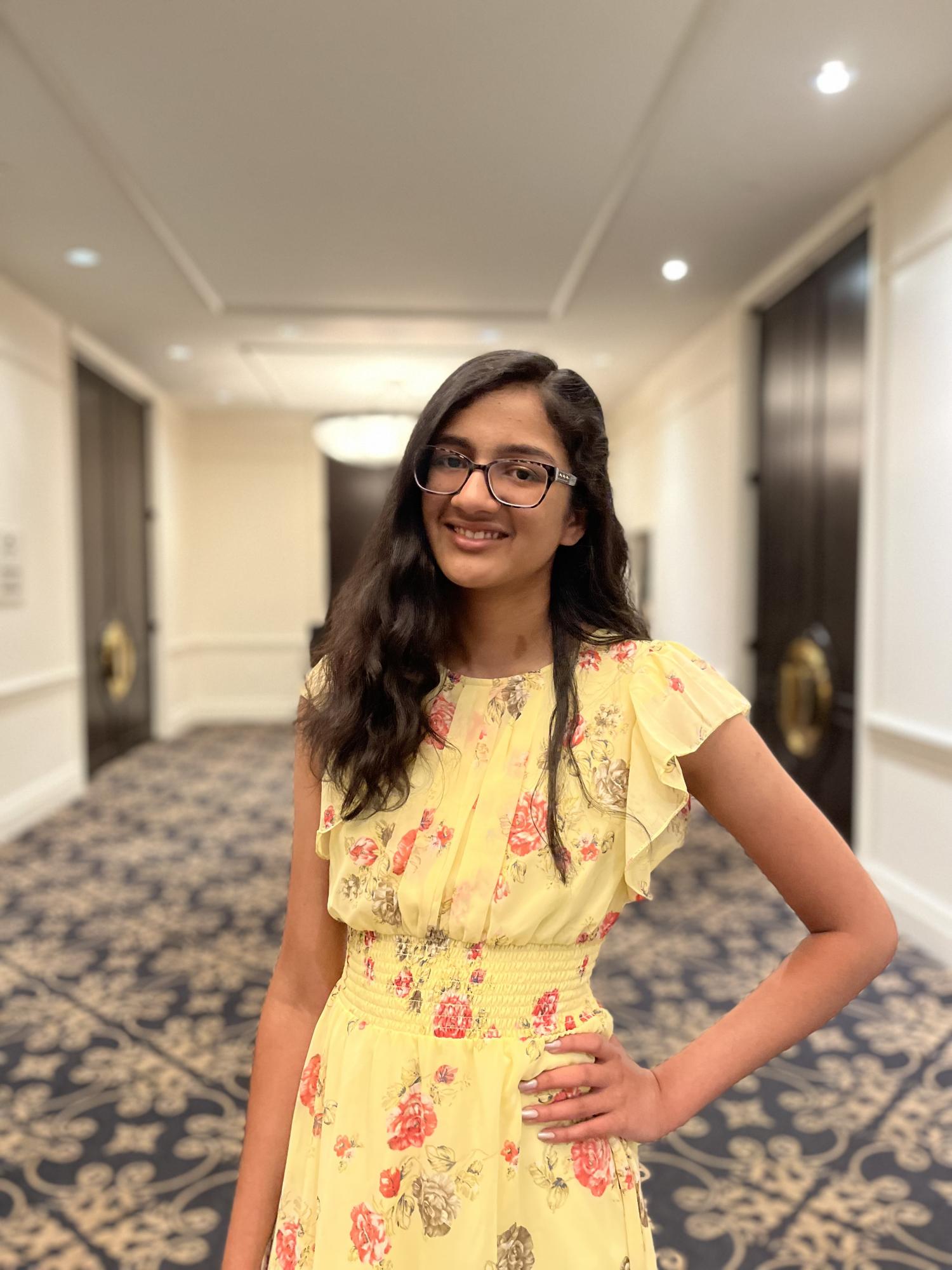 Student in yellow floral dress