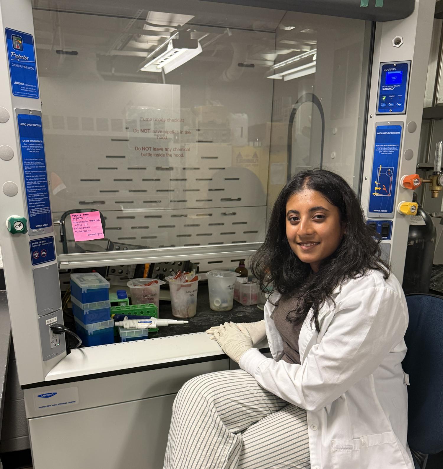 Undergraduate student posing in a laboratory setting
