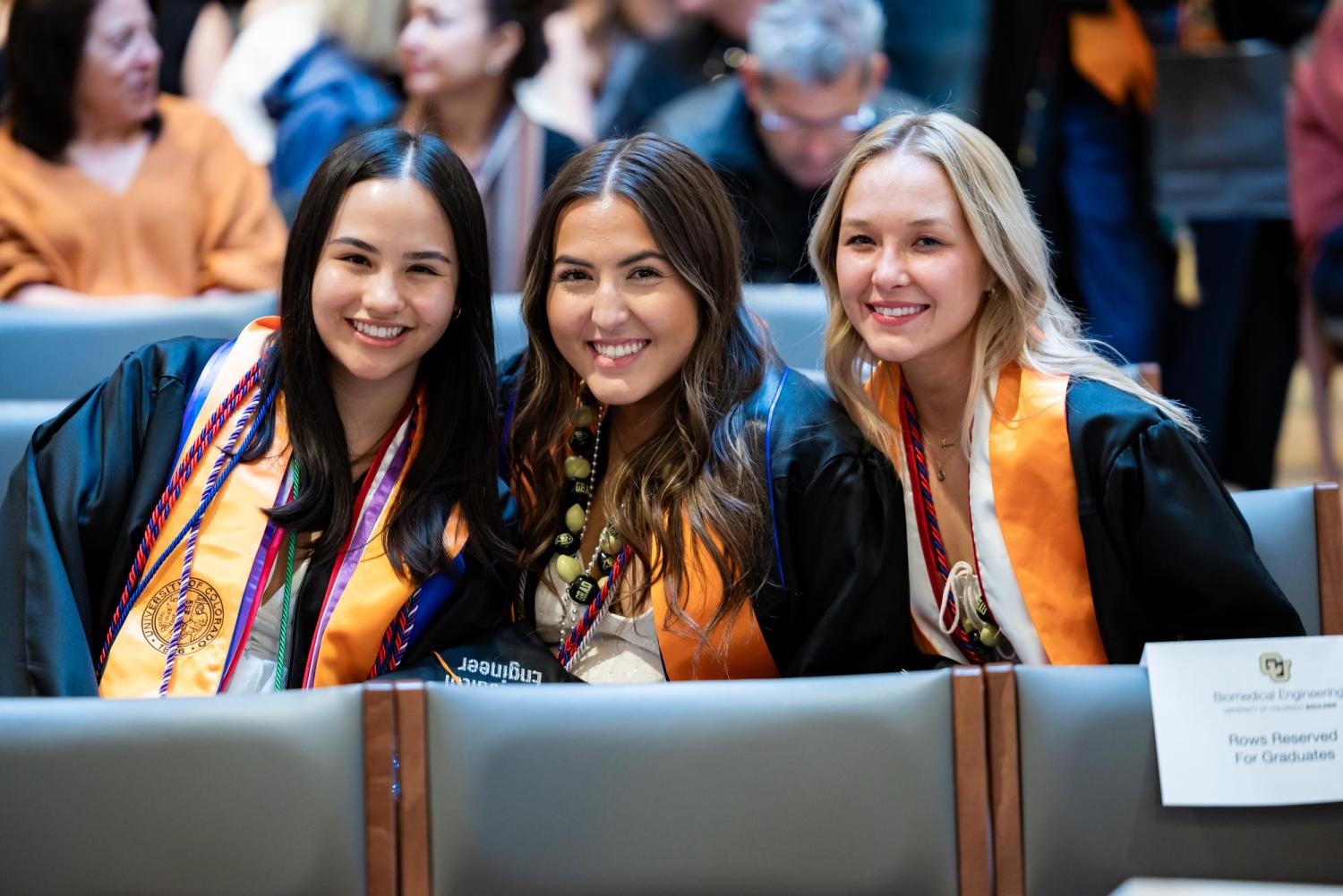 Students smiling at graduation