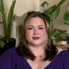 Headshot of person with purple blouse