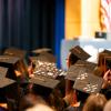 Graduates sitting down at graduation ceremony