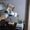 collaborative robots helping pour liquids in a chemical wet lab