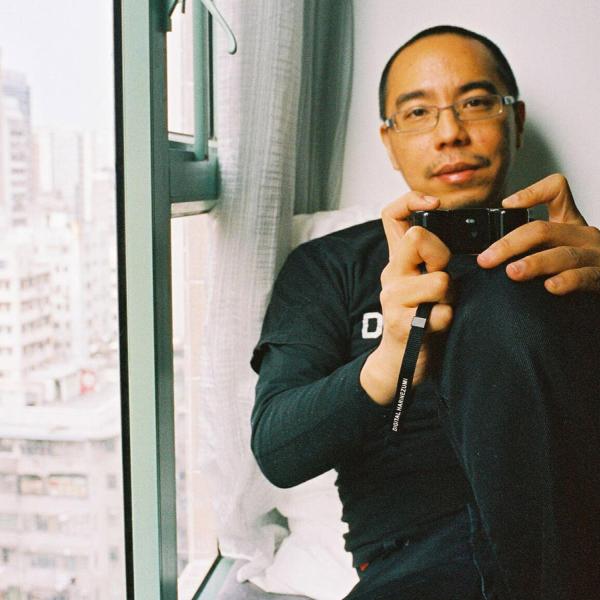 Apichatpong Weerasethakul holding a camera