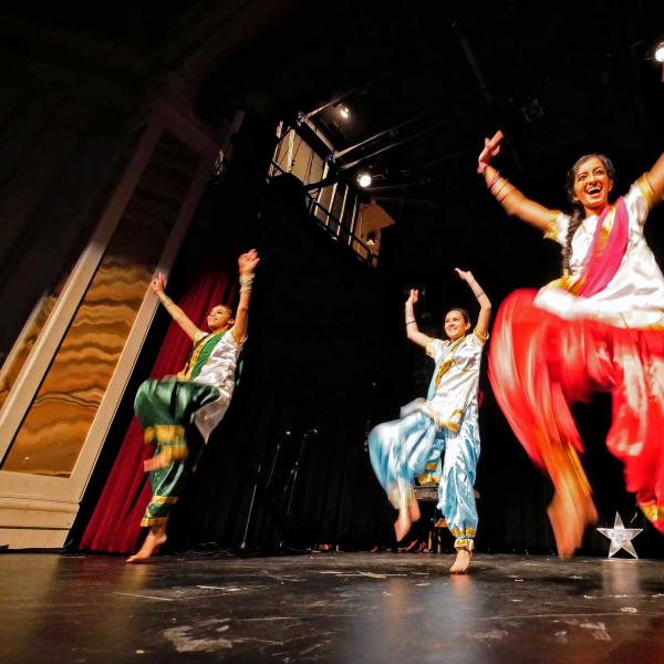Dancers on stage during a Buffs United event in Old Main