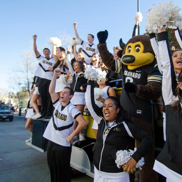 Students cheer with Ralphie mascot during Homecoming celebration