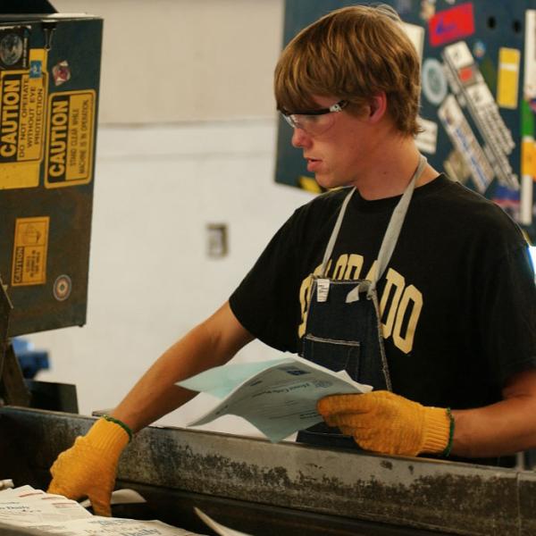 Student sorting at the Recycling Center. Rule of thirds employed to create a clean and easily read image.