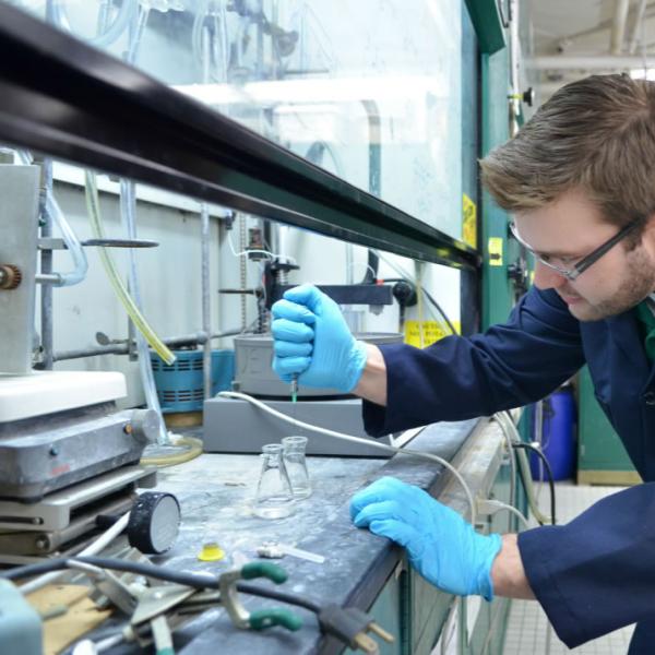 Faculty researcher in the lab. Keep clutter to a minimum to communicate the image more clearly.