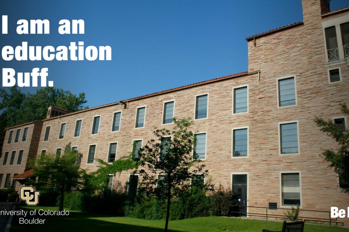 Outside of the Education Building with "I am an education Buff"