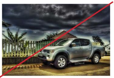 Exaggerated image of a truck with looming storm clouds