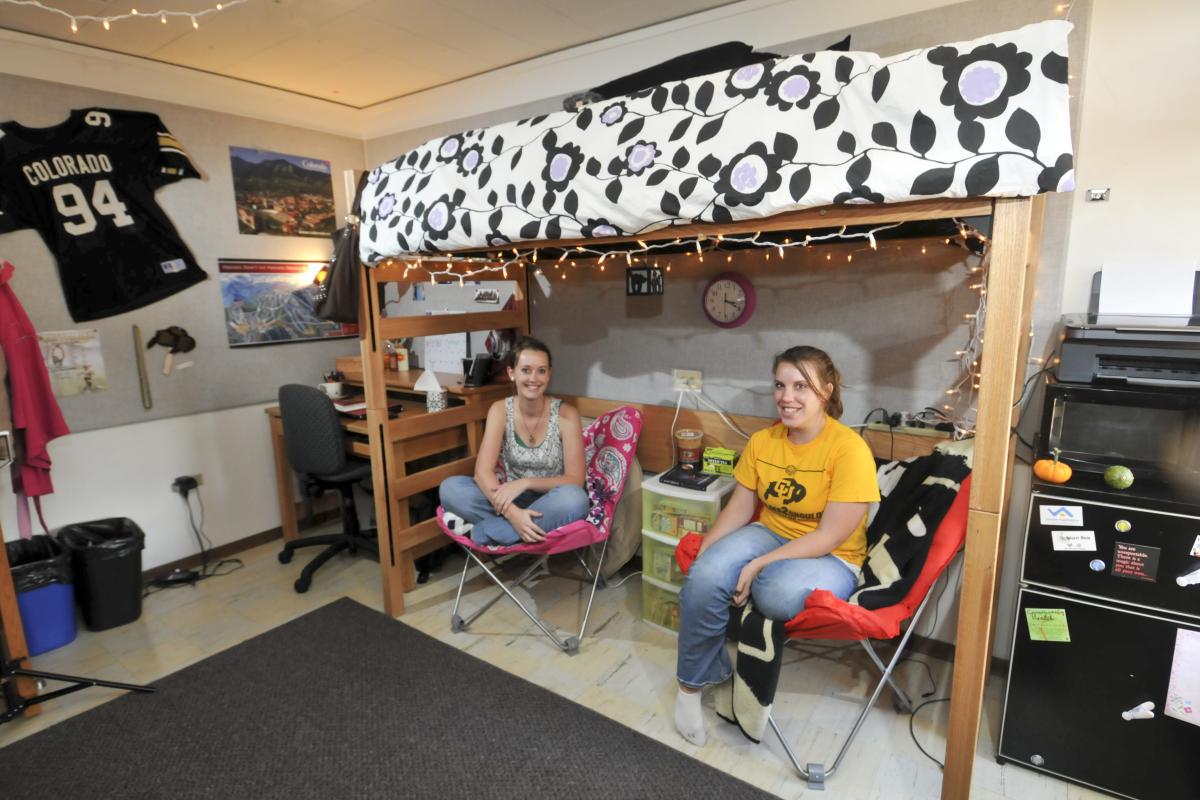 Two girls sitting in their residence hall room
