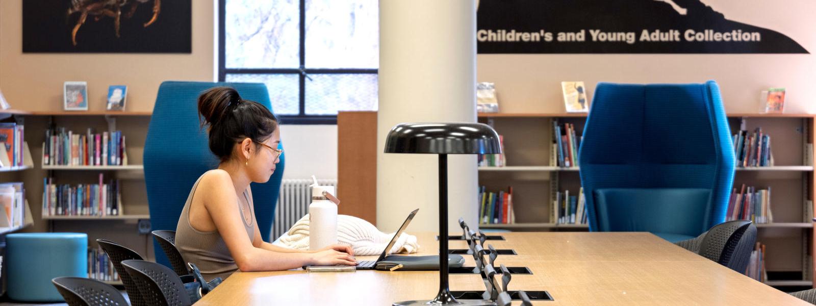 Student studying at library.