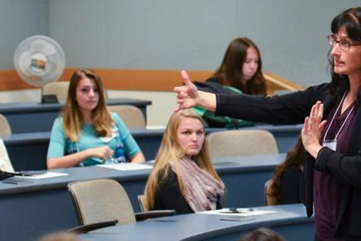 Marketing faculty member in front of a class