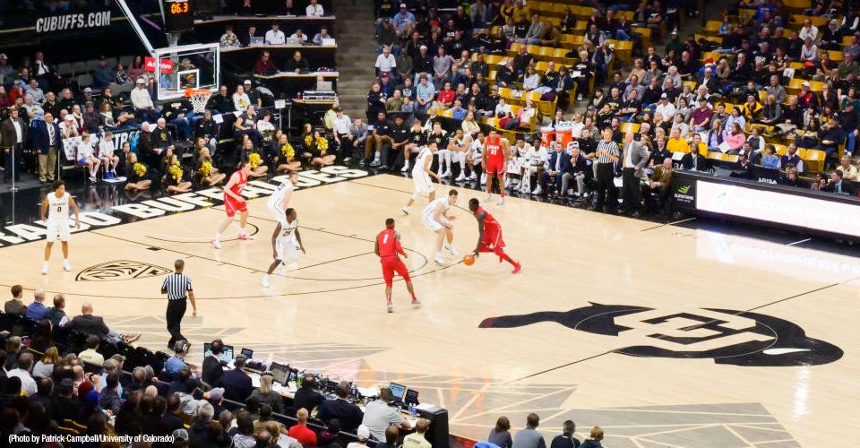 CU buffs basketball team on Coors Event center court playing UNM