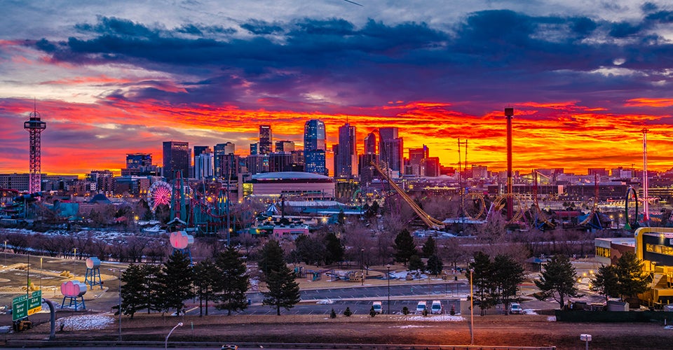 The sun rises over Denver.