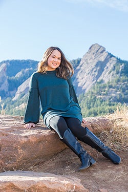 Jessica Yan poses with the Flatirons in the background.