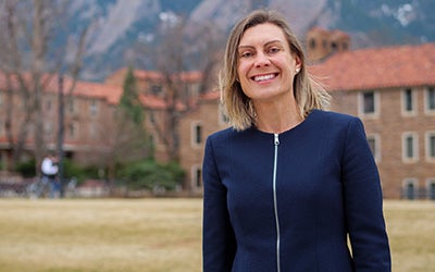 Kathryn Wendell standing outside the residential buildings at CU Boulder.