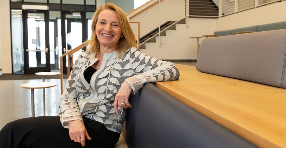 Dean Matusik seated in the new Rustandy Building on the CU Boulder campus.