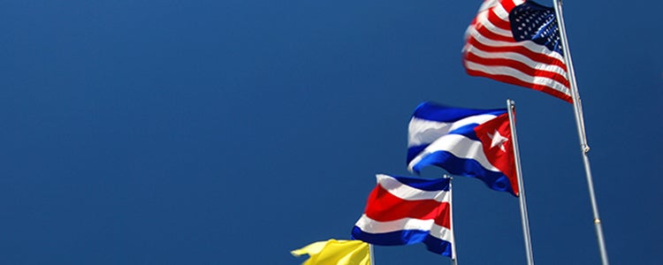 Flags against a blue sky.