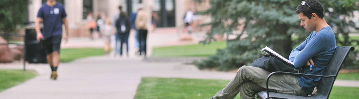 Student sitting on bench