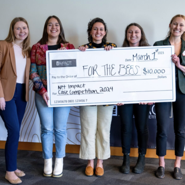 Sustainability Students with Winning Check