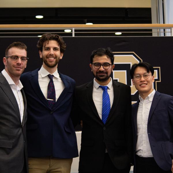 Three Men in Suits Smiling for a Photo