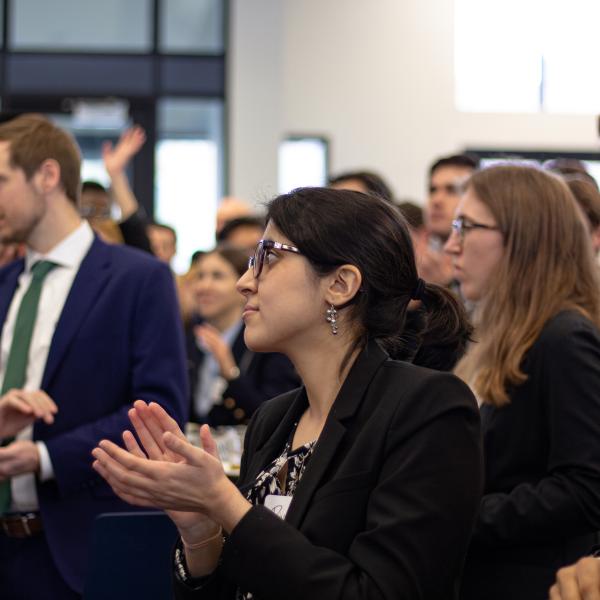 People in Business Suits Listening to a Presentation
