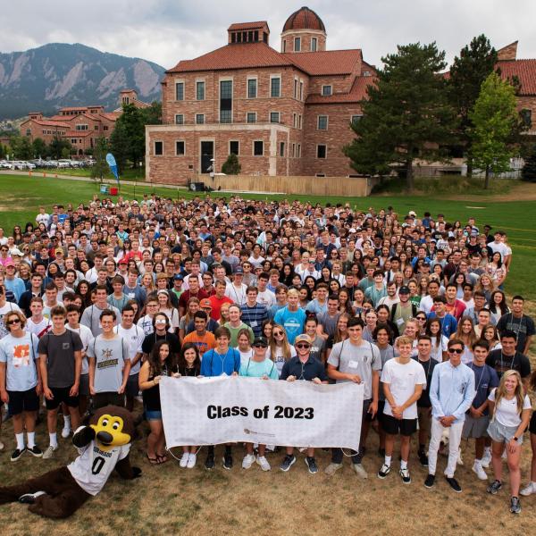 The Class of 2023 poses with their class banner during Leeds Launch Day before their freshman year.