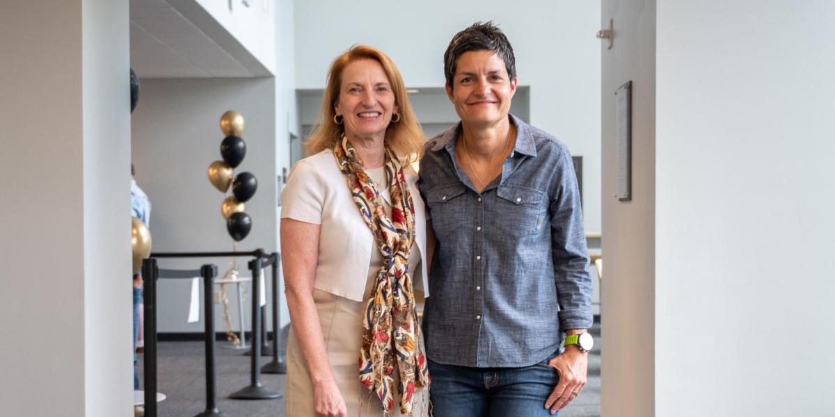 Sharon Matusik and Yonca Ertimur pose in the Rustandy Building.