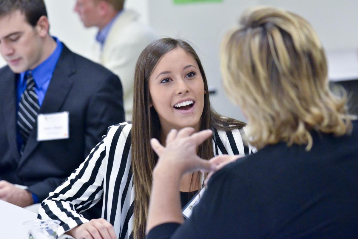 Student speaking with advisor