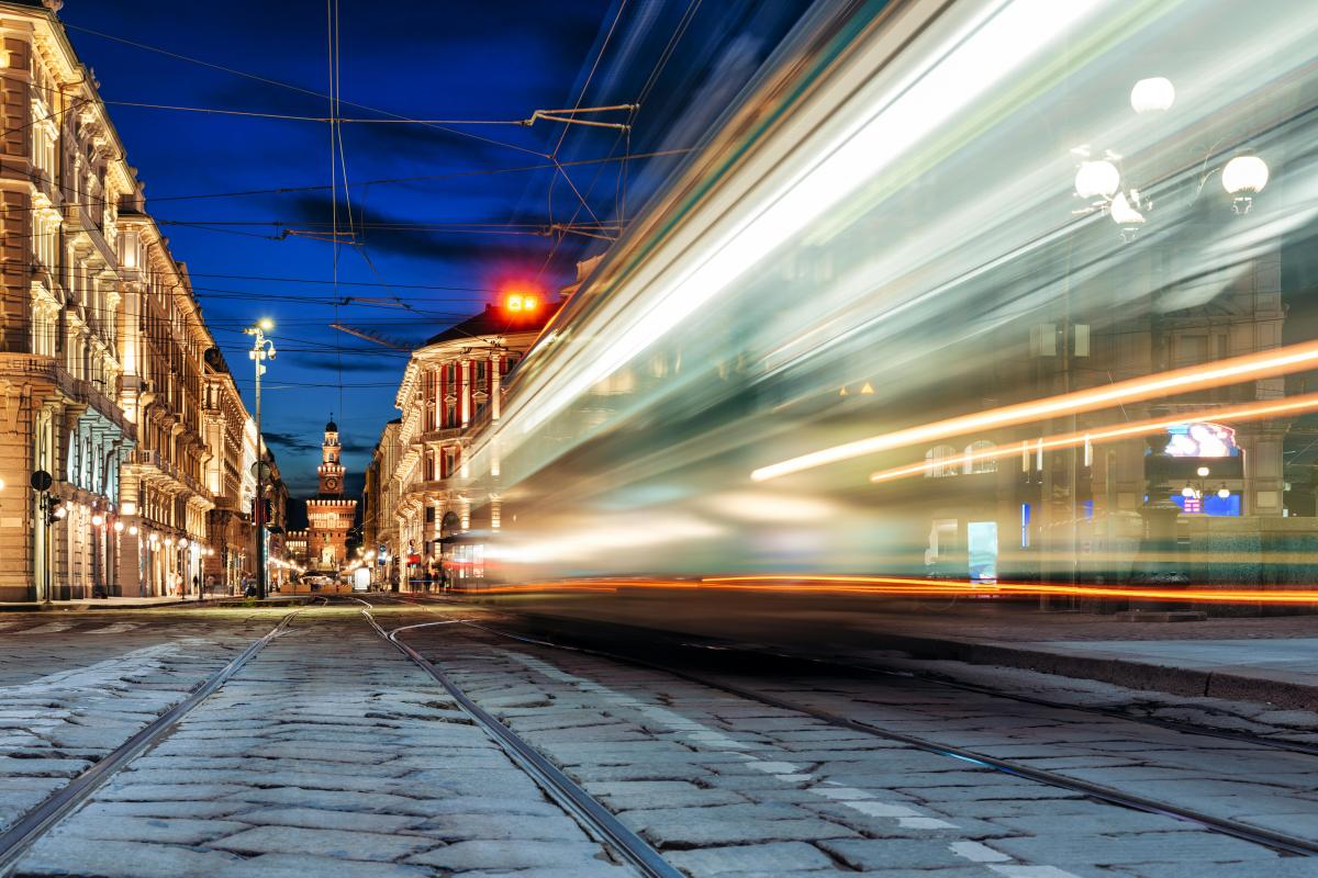 Milan at night; light streaks across the right side of the frame