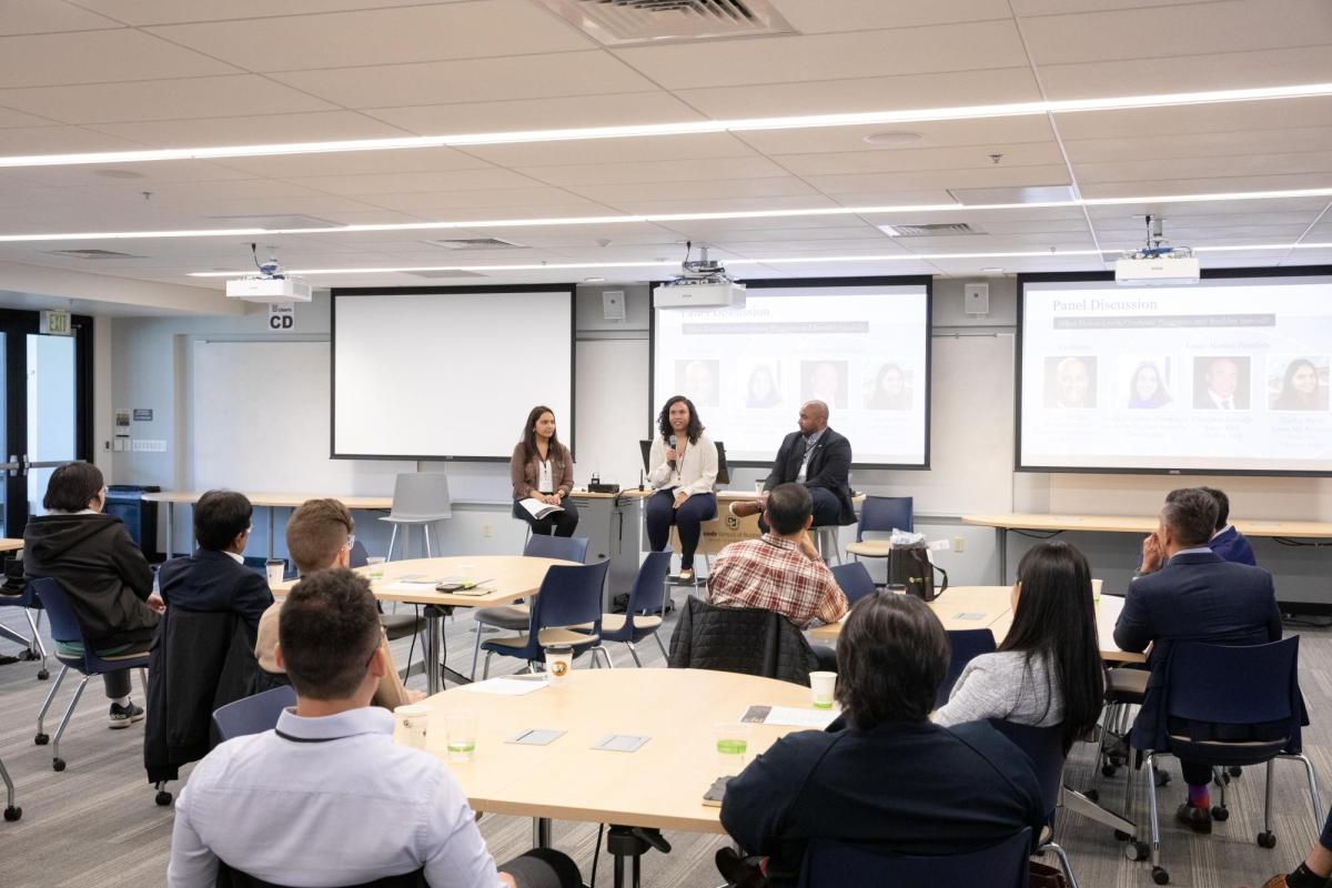 Speakers addressing an audience of prospective students