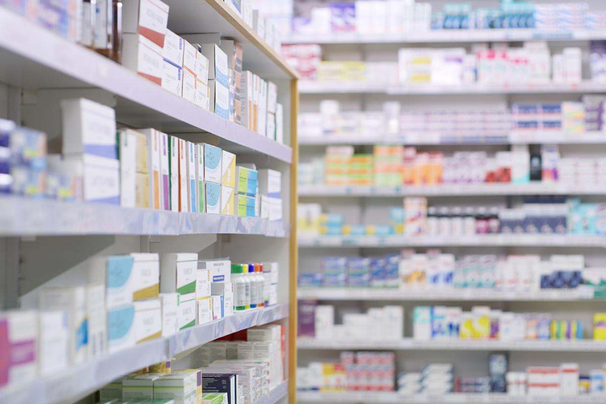 Store shelves full of different products in boxes.