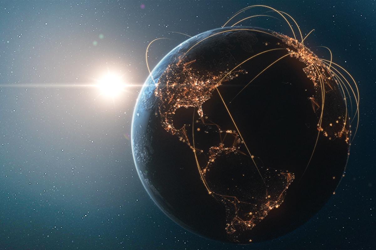 The globe, at night, with points of light visible.