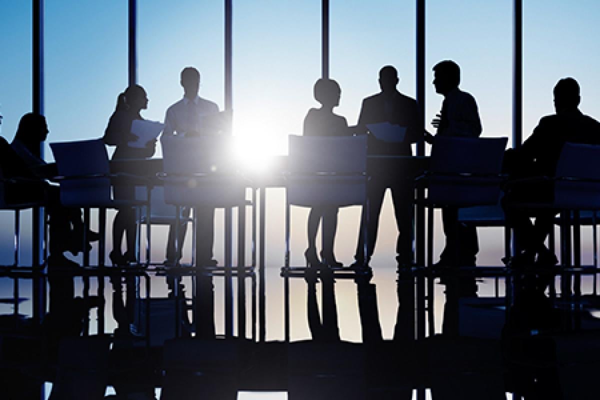 A group of people discussing at a table