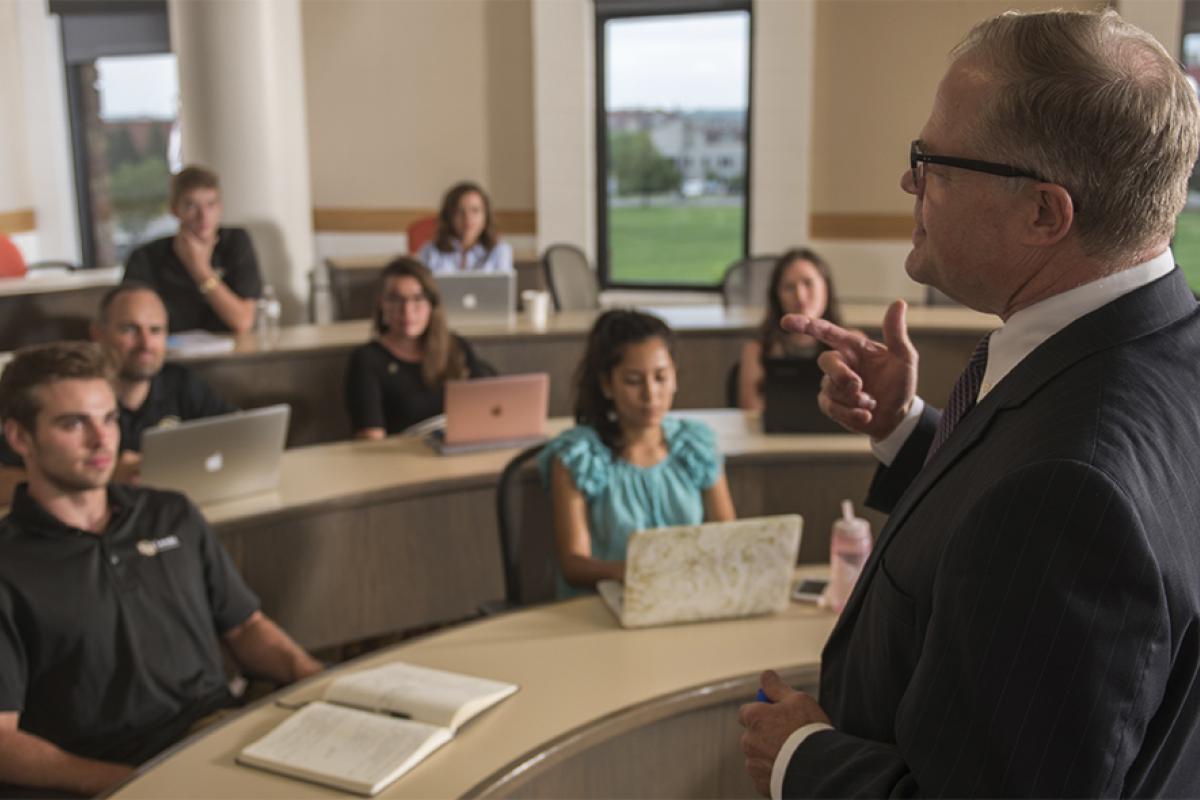 A professor leads a discussion in a classroom.
