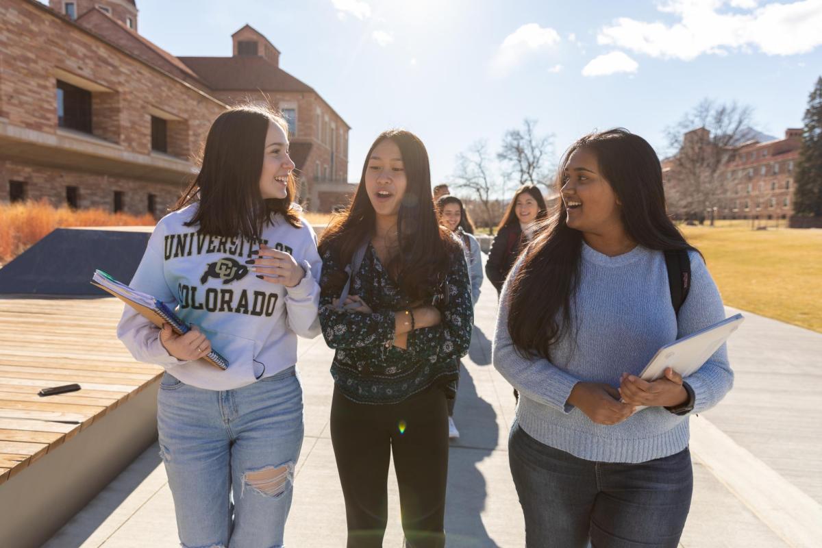 Students walk outside on the CU Boulder campus.