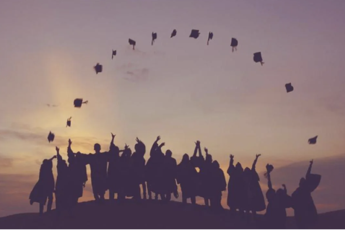Students Throwing Grad Caps