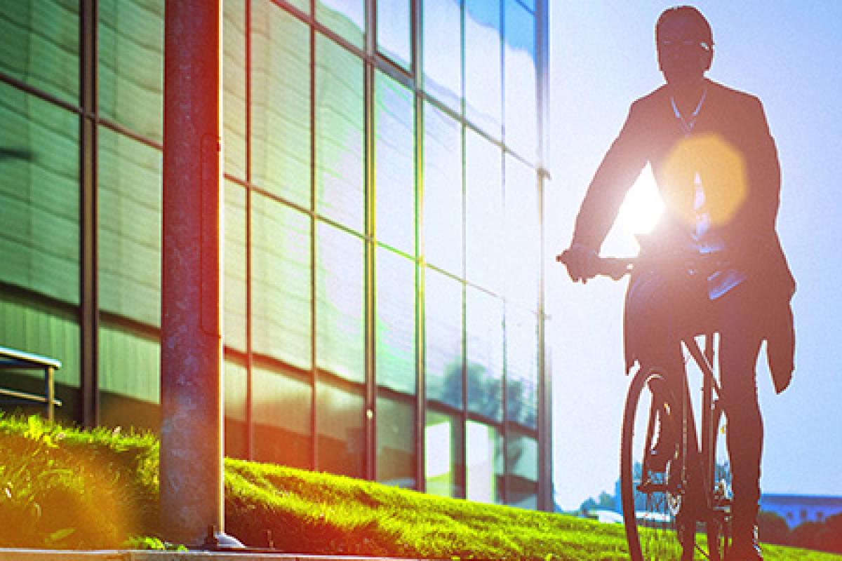 A man biking to promote sustainability