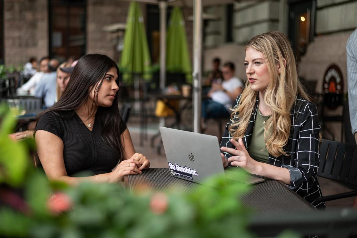 Two women discussing