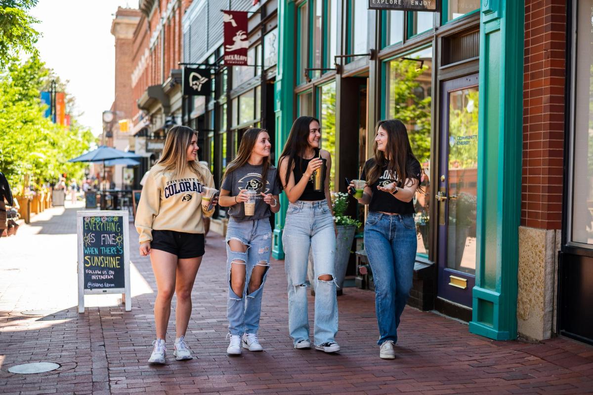 4 girls walking down pearl street