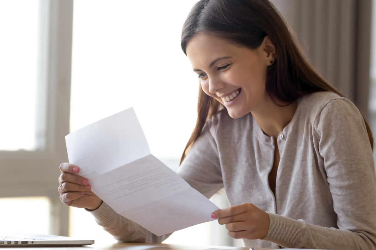 Young woman opens a scholarship letter