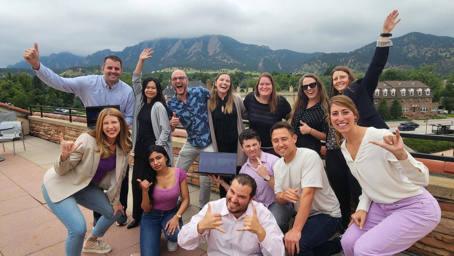 HGV Fellows on balcony with Flatirons in the background