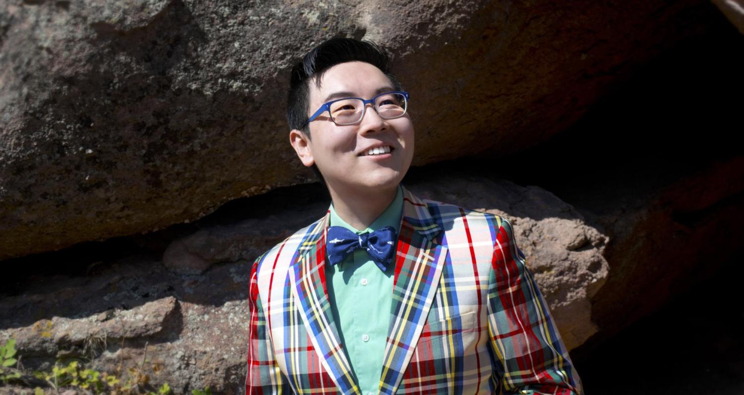 Z Yang wearing a bow tie standing in front of the flatirons.