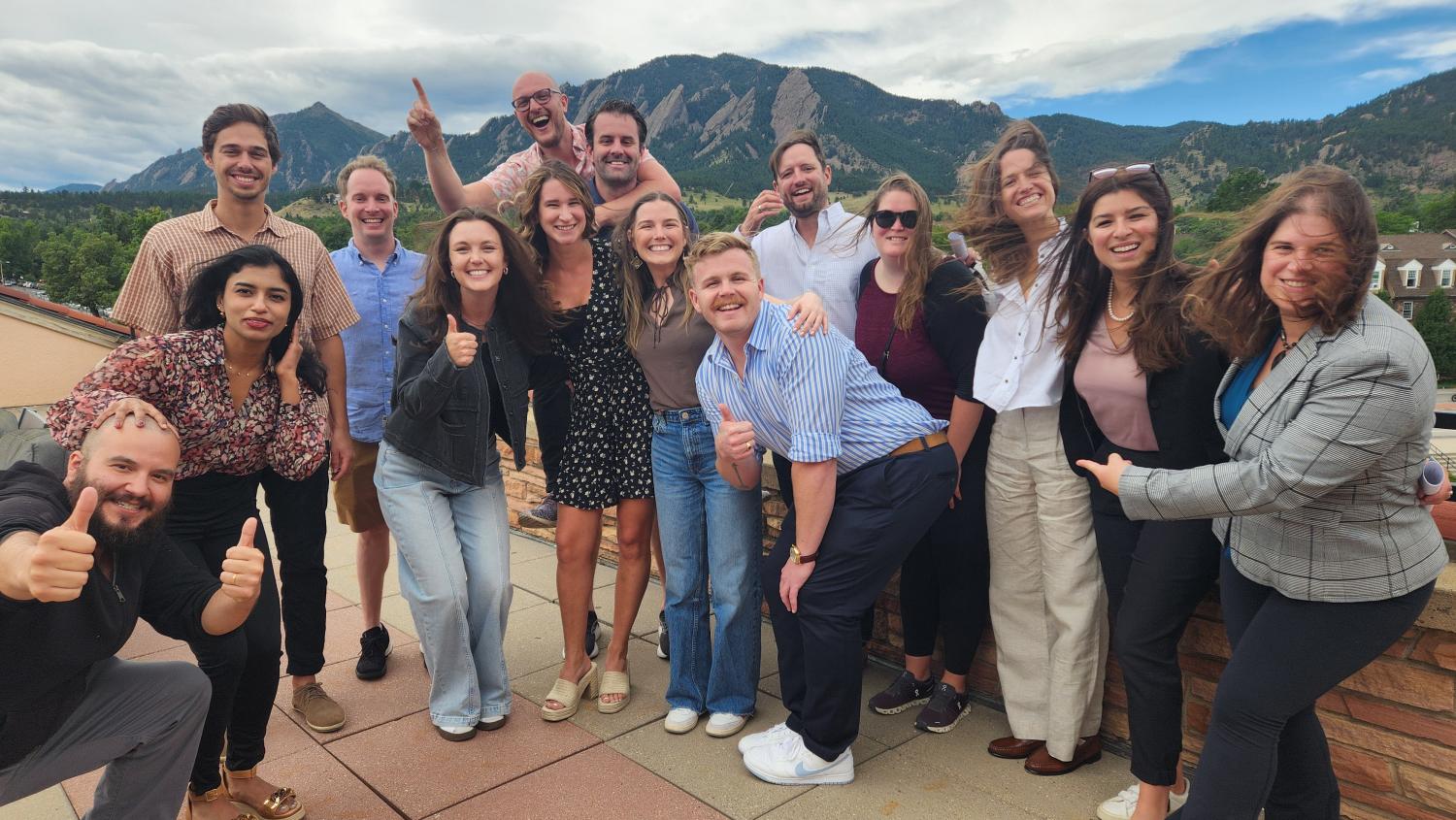 Group of HGV Fellows on Roof of University of Colorado Boulder smiling.