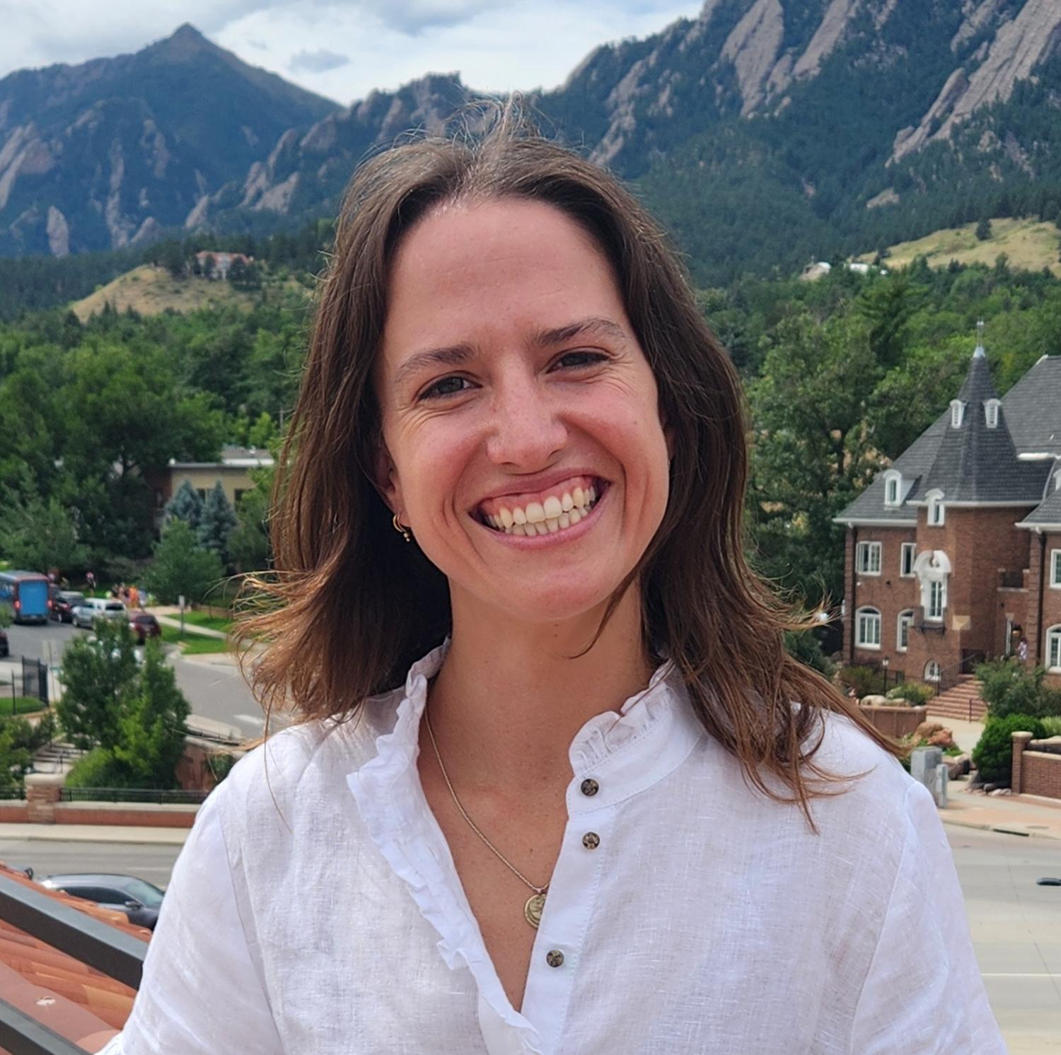 Photo of Alex Kaindl in front of Boulder Flatirons