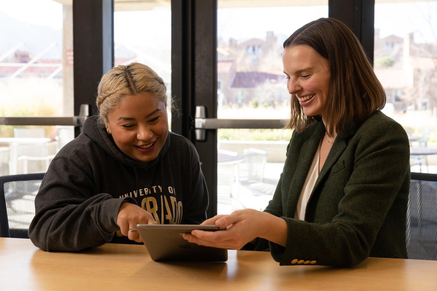Rebecca Mitchell smiles while working with a student
