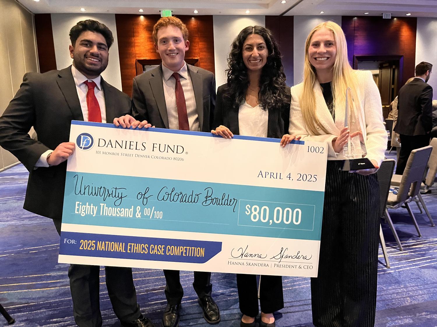 Daniels Fund National Case Competition winners pose with a giant check