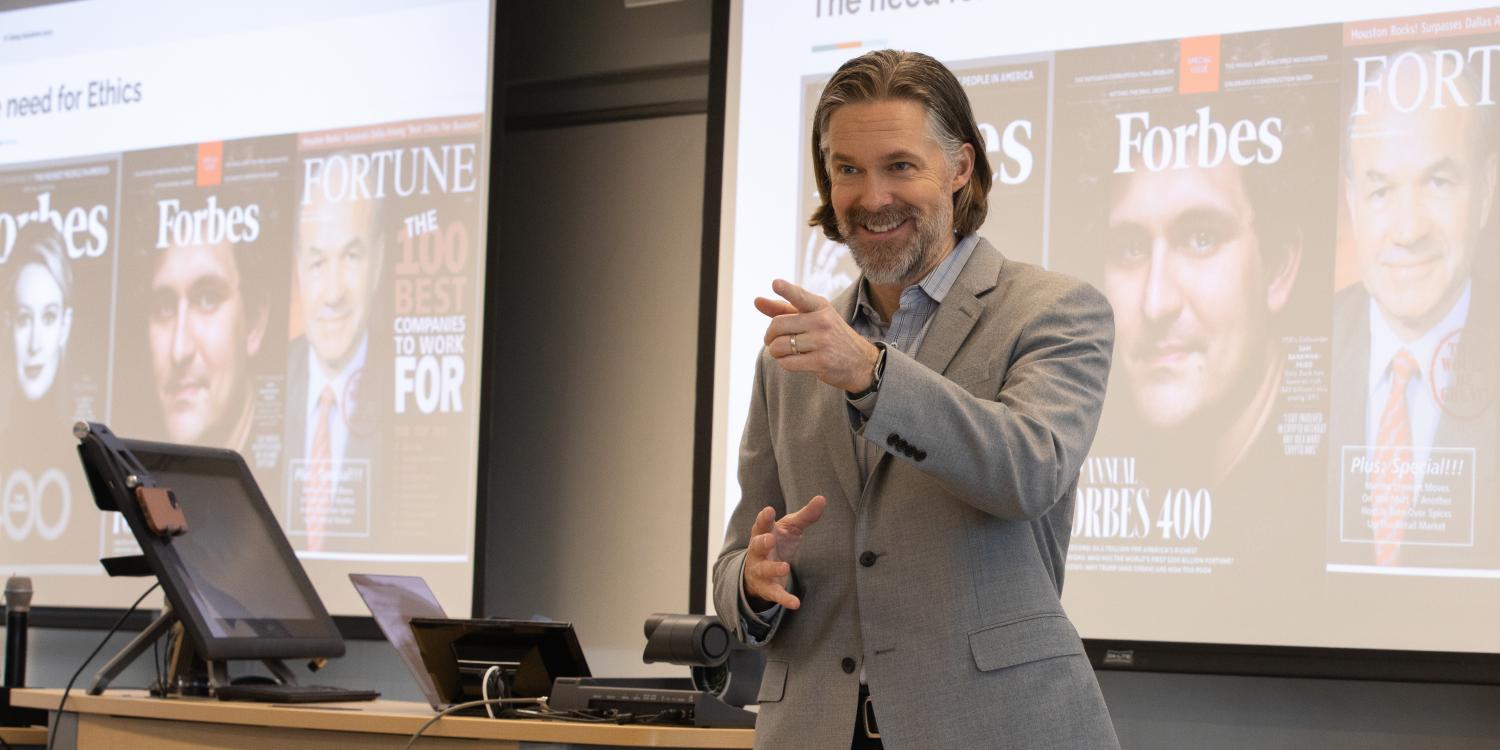 Matthew Brady addresses student during an event