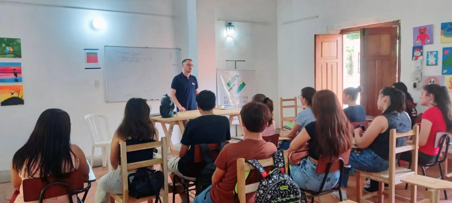 Ben Dant teaching high school students in Paraguay