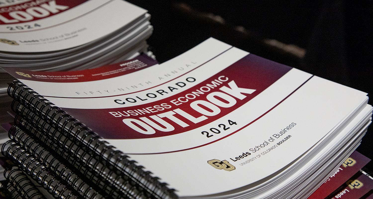 A stack of the Business Economic Outlook Forum booklets from 2023.